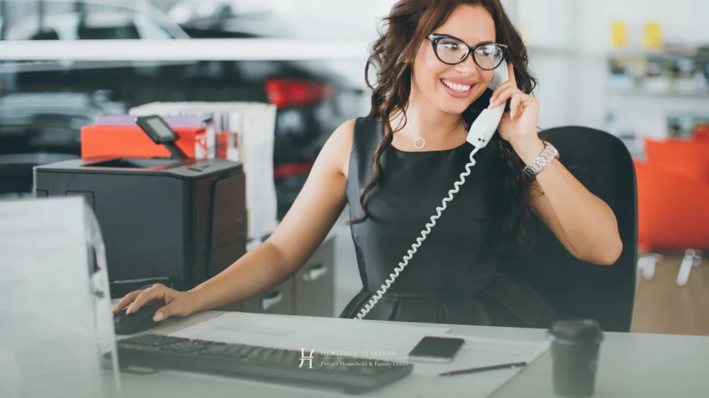 Executive assistant in office on phone illustrating skills mismatch when transitioning to private PA role