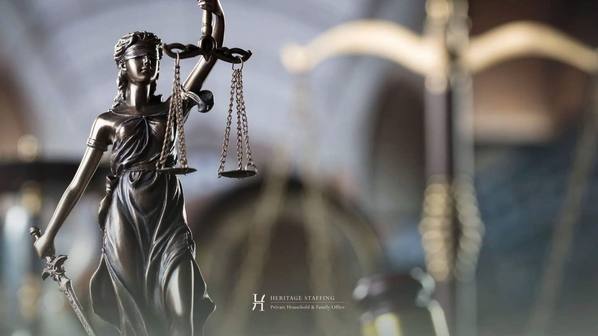 Statue of Lady Justice symbolizing Swiss and EU labor compliance in cross-border employment