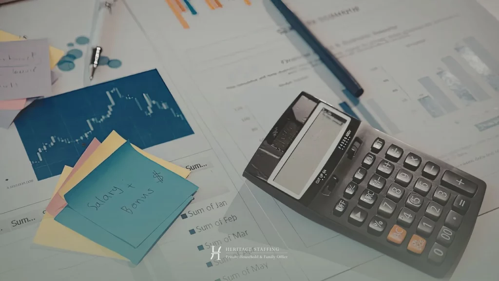 Financial documents with charts calculator and notes on salary and bonus analysis in a family office context