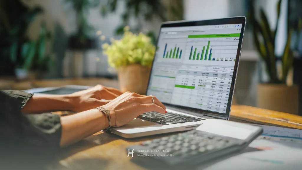 Professional managing household operations via laptop dashboard with performance metrics in Switzerland
