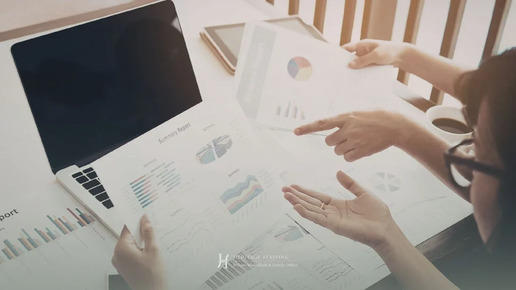 professionals reviewing printed reports and data charts, illustrating risks of undocumented knowledge in estate management