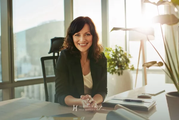 professional chief of staff seated at desk in modern office, representing strategic leadership in UHNW household management