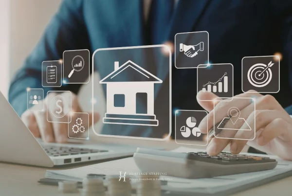 Business executive calculating estate finances with digital house interface symbolising risks of undocumented household operations.