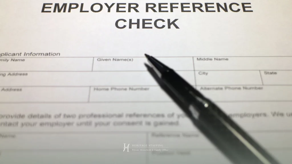 employer reference check form with pen, highlighting confidentiality risks in DIY recruitment processes