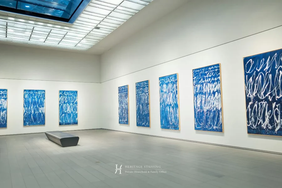 Minimalist fine art gallery with large blue abstract paintings illustrating inventory chaos in art collections