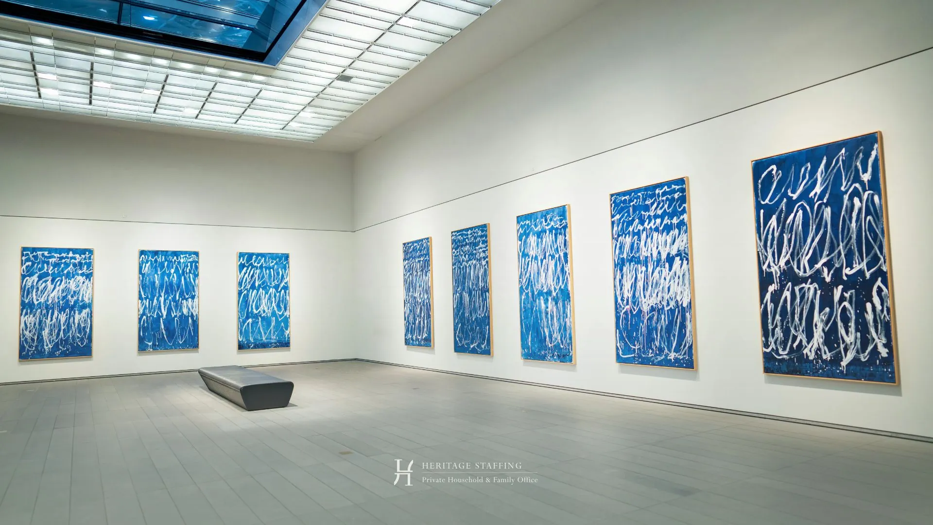 Minimalist fine art gallery with large blue abstract paintings illustrating inventory chaos in art collections